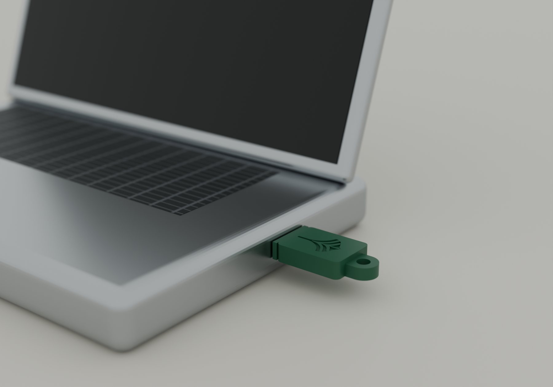 A green Leif key plugged into the USB-C port on the side of a laptop.